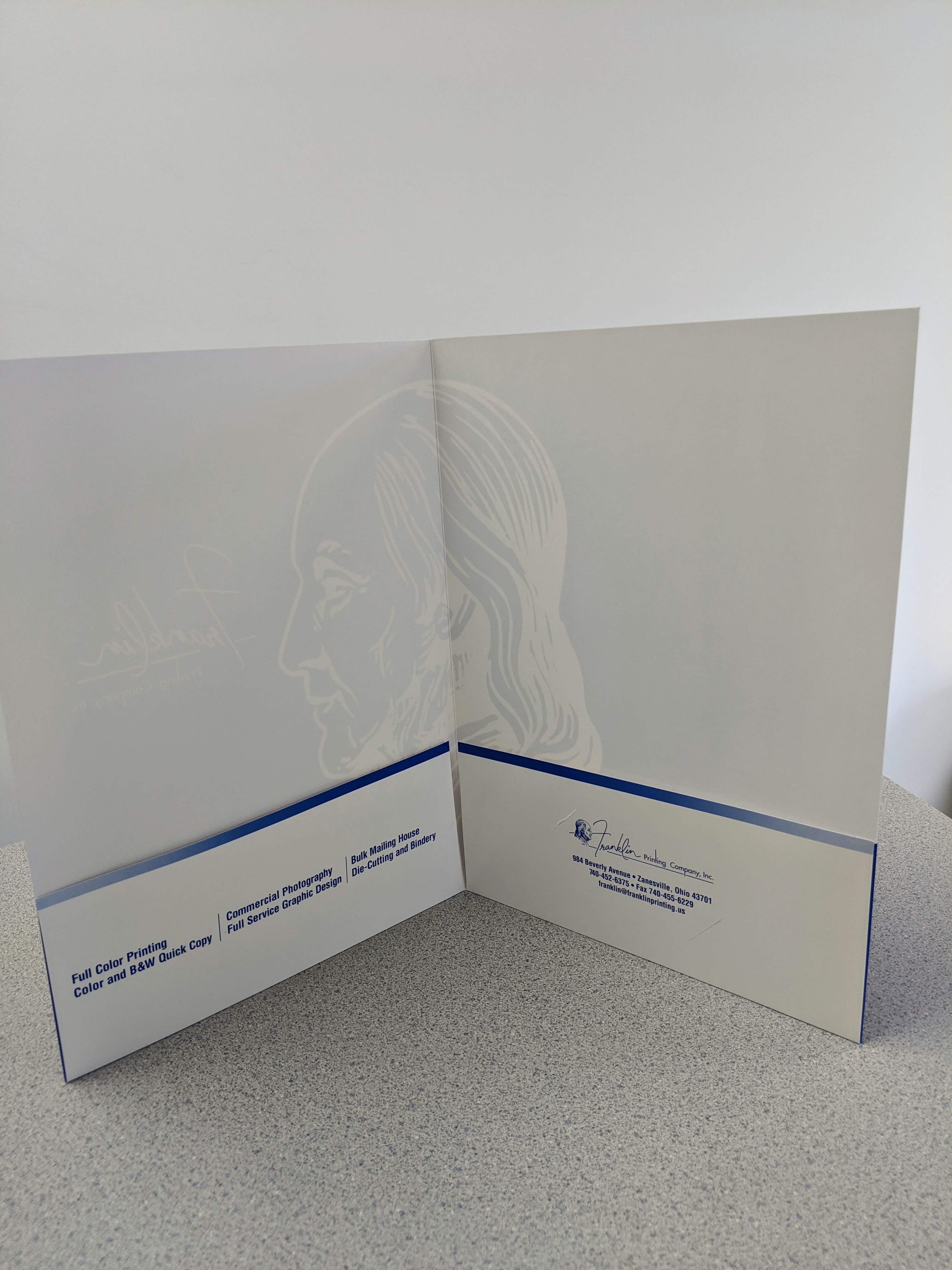 Inside of a Franklin Printing presentation folder showing service pockets